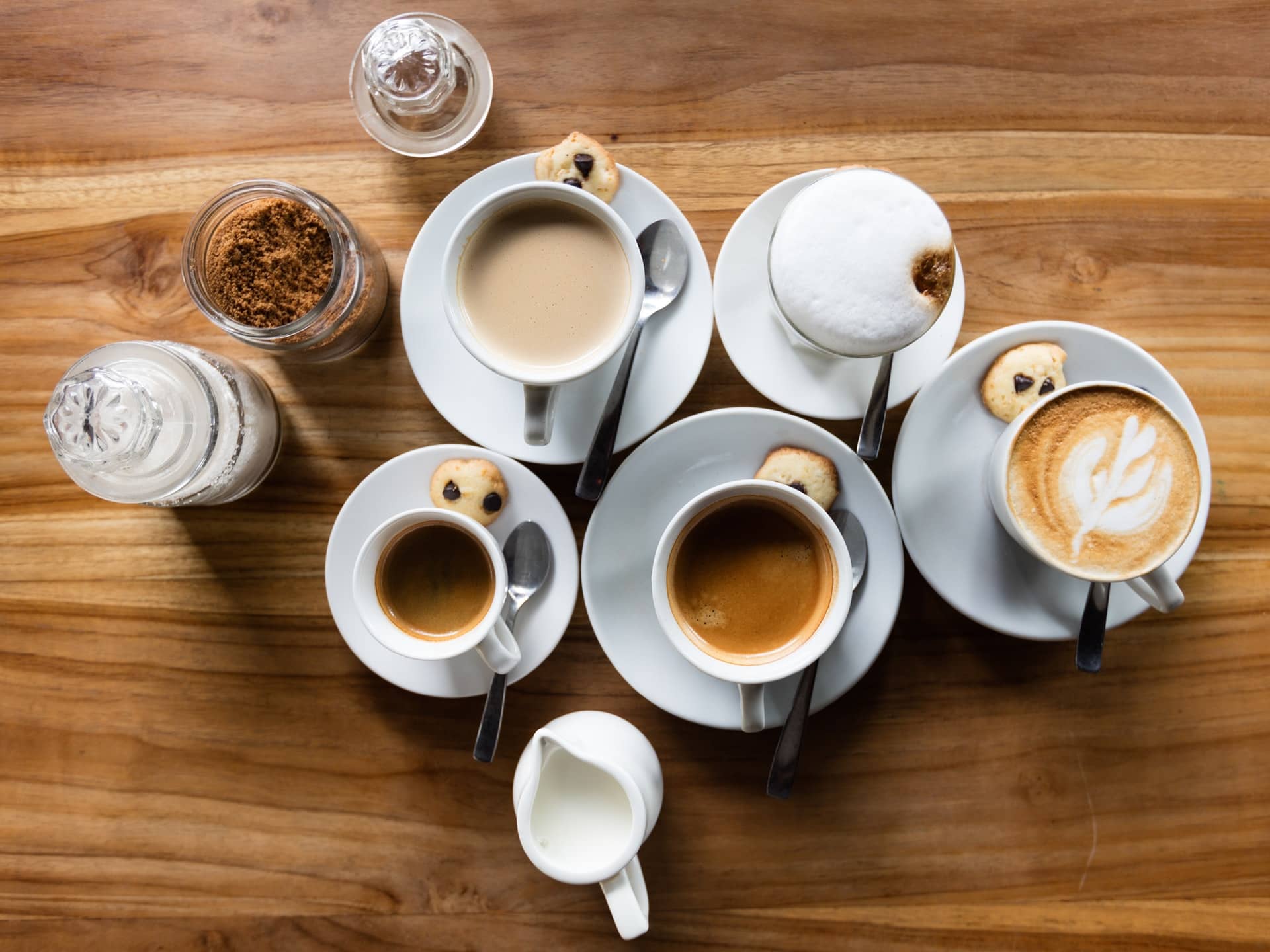 A table full of coffee drinks